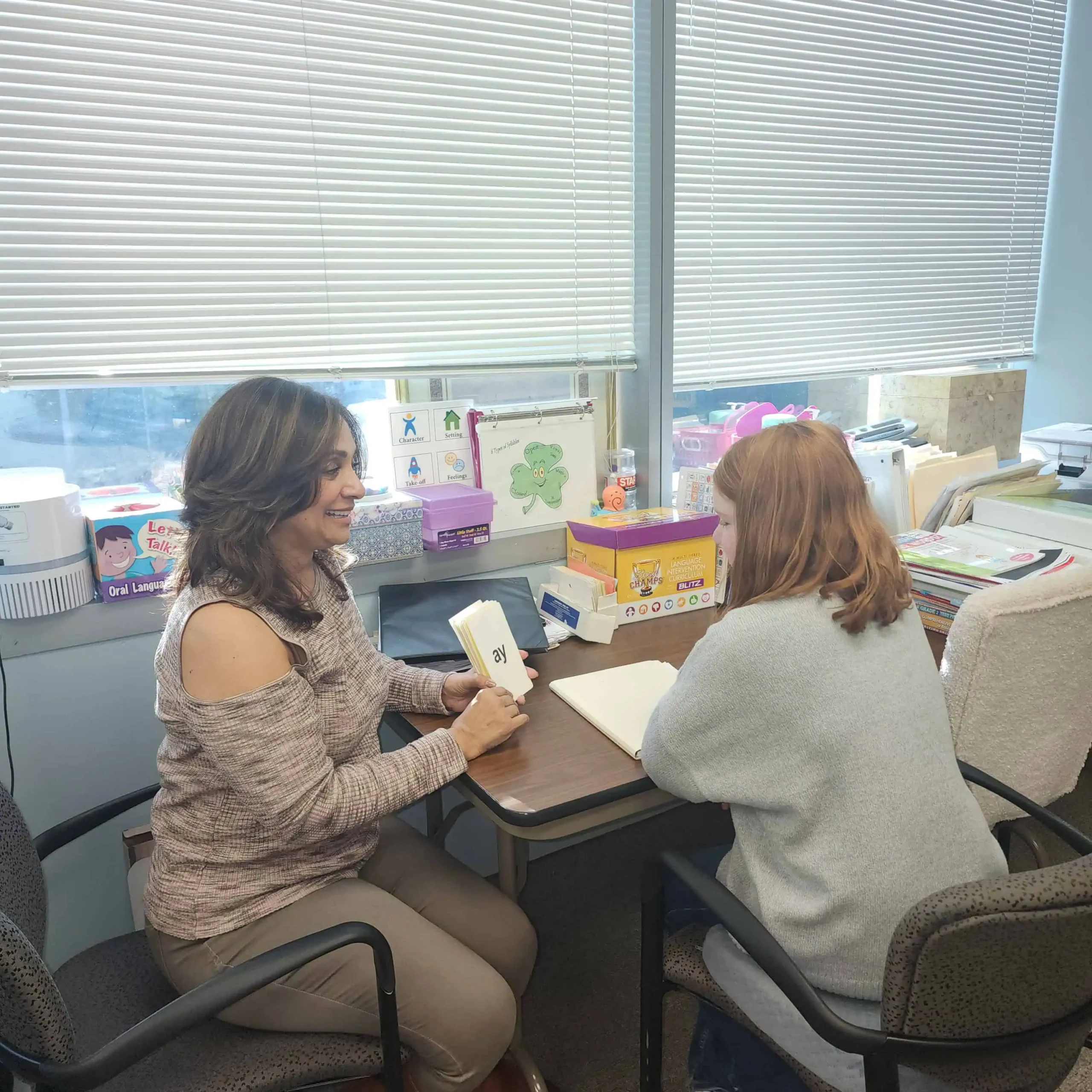 Rebecca Thomas in language therapy session with girl